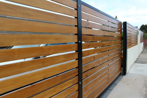 Modern driveway gates. The Kingston. Deep metal framed with Cedar timber infill.